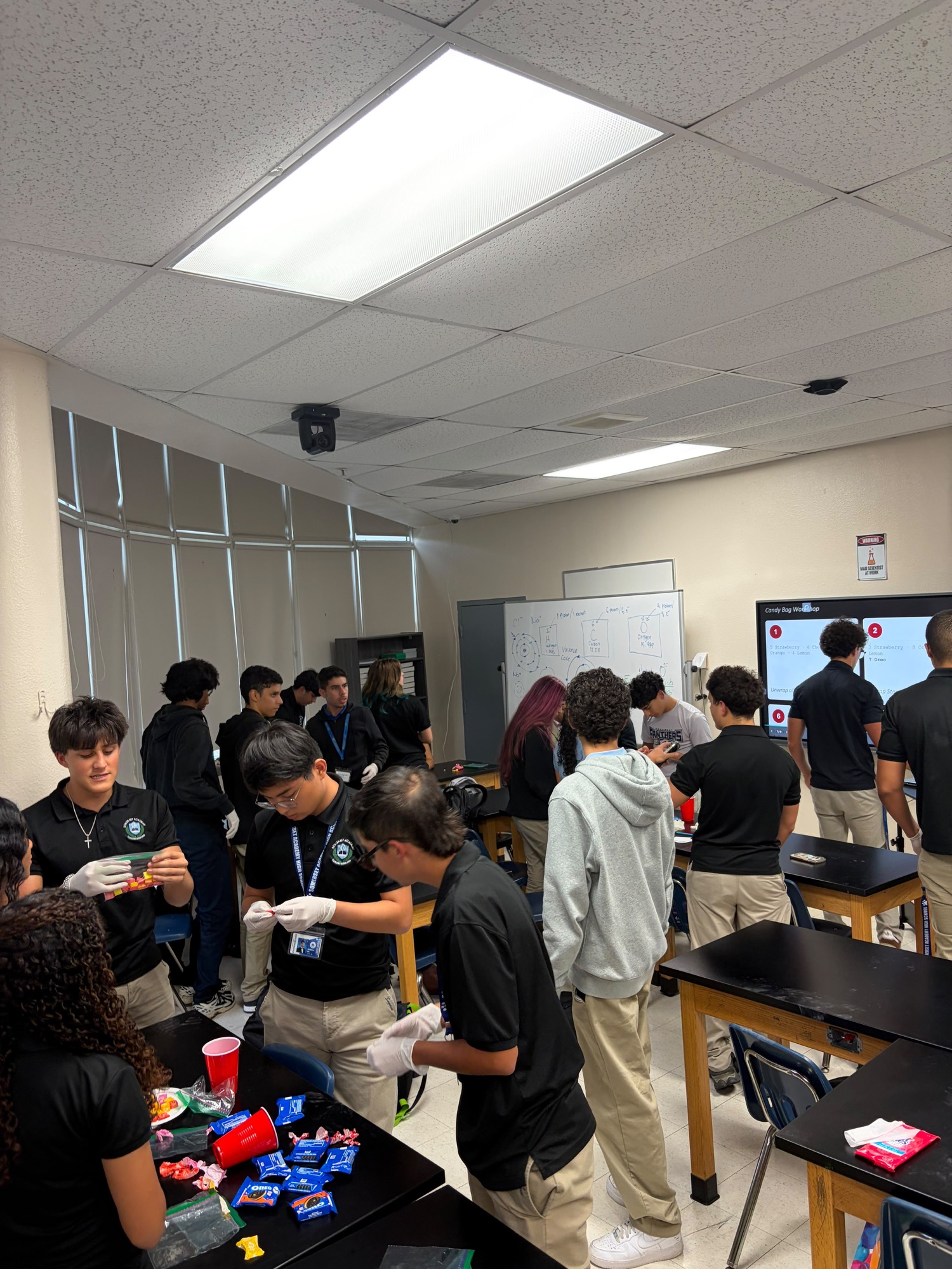 Students in an EnginX workshop working through a hands-on activity at lab tables